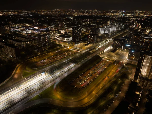 An aerial perspective highlights the seamless integration of architecture and transportation at the Noord Zuid metro station.