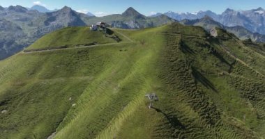 Aerial drone video of Fronalpstock in the Swiss Alps showcasing the natural beauty of the region in summer, alpine meadows, perfect for hiking, camping and outdoor activities.