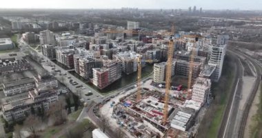 Diemen, 5th of February 2023, The Netherlands. Experience the excitement of a new construction project with stunning aerial footage of a residential tower being built in Diemen, showcasing the