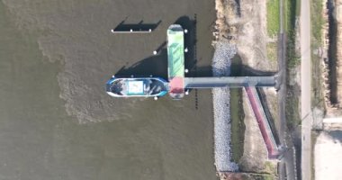 An Amsterdam ferry captured from above, showcasing the citys vibrant transport system and the hustle and bustle of its inhabitants.