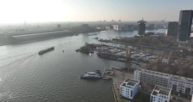 Amsterdam, 13th of February 2023, The Netherlands.A breathtaking aerial tour of the Ij river, featuring Amsterdams GVB ferries and the citys famous lookout tower.