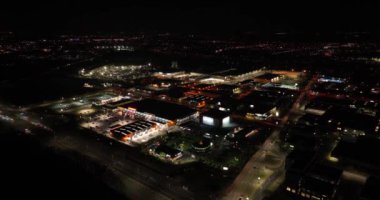 Nieuwegein, 8th of February 2023, The Netherlands. A captivating aerial drone video captures the commercial heart of the city at night, with a bustling construction market, storage box company, and