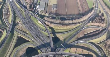 See the seamless integration of urban infrastructure and transportation with an aerial view of Ridderkerks busy highway intersection.