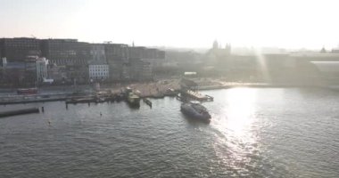 Amsterdam, 13th of February 2023, The Netherlands. Watch as passengers board the iconic public transport ferries and sail away on a scenic journey through the heart of Amsterdam.