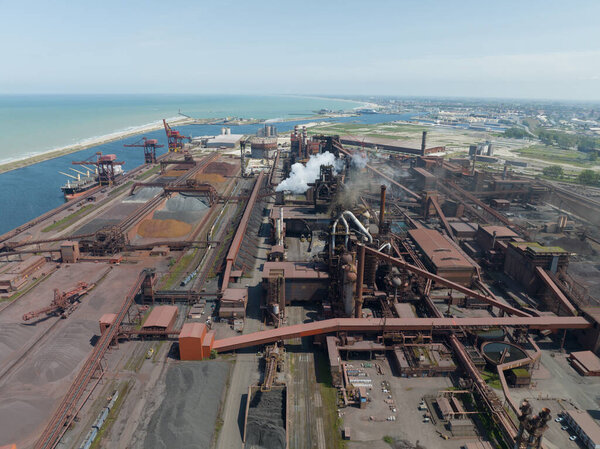large steel factory near Dunkerque Grande-Synthe in France. Aerial drone view.