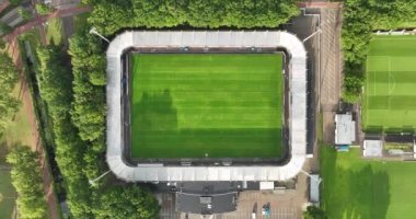 Aerial drone video of a top down video on a small football stadium in Waalwijk, the Netherlands.