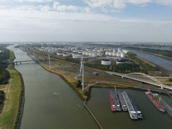 The Europoort is an industrial and port area south of the Nieuwe Waterweg and north of the Hartel Canal , east of the Maasvlakte and west of the Botlek in Rotterdam. Aerial drone video.