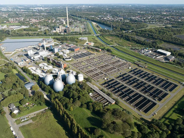 Aerial top down view of a sewage treatment plant. Cleaning of water, purifying, wastewater treatment, industrial sewage treatment. Bottrop, Germany.