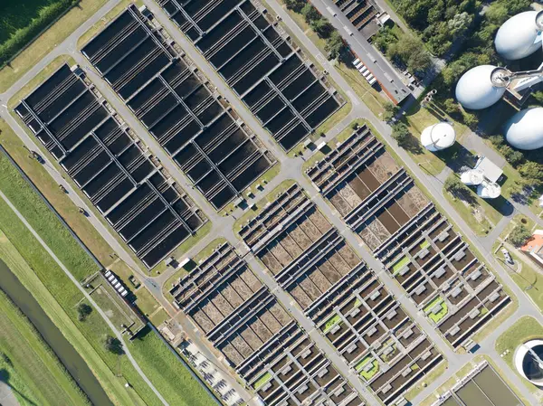 Aerial drone view of a water cleaning facility in Germany, emphasizing wastewater treatment, water treatment, drinking water, water supply. Clean water.