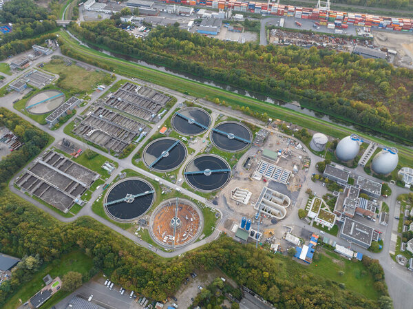 Aerial top down view on a waste water treatment plant. Water filtration installation. environment, ecology and recycling.