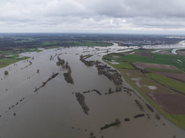 Aerial drone view of high water flooding on the Ijssel river. The Netherlands. Between Zutphen and Deventer.