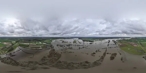 Overflow and high water, river Ijssel overflowing because of excessive rain and meltwater. Aerial drone view.