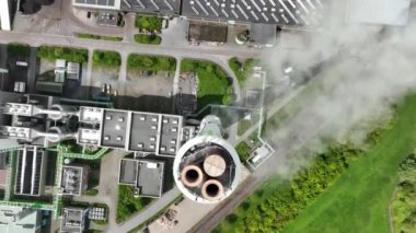 Top down aerial drone view of the smoke stack and gases coming from The Asdonkshof waste incineration plant in Kamp Lintfort.