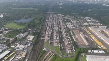 Aerial hyperlapse drone view on the Cologne Eifel Gate intermodal transportation from road on train. Loading bay. arge-scale transshipment facilities. Aerial time lapse