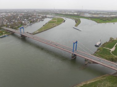 The Friedrich-Ebert-Brucke is a cable-stayed bridge for road traffic over the Rhine near the German city of Duisburg. Aerial drone view.