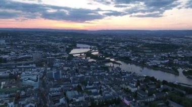 Koblenz, Germany, aerial hyperlapse over the city center at sunset. City infrastructure, traffic, buildings and skyline. Aerial view.