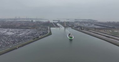Aerial view of the entrance towards the Zeebrugge sea terminal, ship passing through. Belgium.