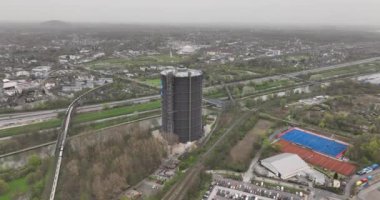 Gasometer Oberhausen is a large gas holder in Oberhausen, Germany. Now a museum. Industrial heritage, aerial drone view.