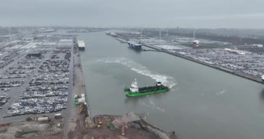 Zeebrugge, West Flanders, Belgium, 10th of March, 2024: Aerial drone view on the Seaport of Bruges. Roll on Roll off terminal. car transportation terminal.
