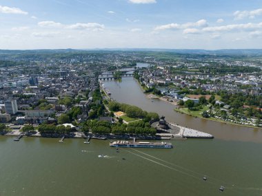 Aerial drone view of the deutsche Eck, monument in the city of Koblenz, Germany at sunset. Birds eye view.