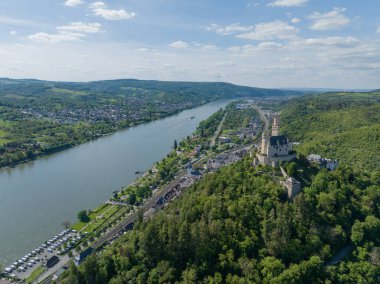 Aerial drone view on the Marksburg castle in Braubach under Koblenz in Germany along the rhine river. Birds eye view. clipart