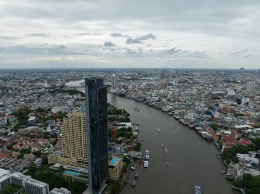 Bangkok, amphoe mueang Bangkok, Thailand, June 24th, 2024: Icon siam Banks and shopping mall along the Chao Phraya River in Bangkok. clipart