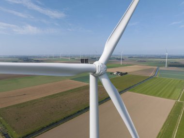 Close up drone view of wind turbine, Generation of green sustainable energy in The Netherlands. clipart