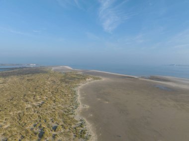 An aerial drone view of the beach at Texel, The Netherlands, dunes and sand. clipart