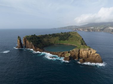 Ilheu de Vila Franca do Campo, small island of the coast of the Azores, Portugal. Aerial drone view. clipart