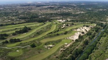 Noordwijkse golf kulübü Noordwijkse Golf Kulübü, Hollanda 'nın eşsiz bir parçası olan Kennedy-Zuid bölgesidir. Kum arazi çeşitliliği bitkiler ve hayvanlar. Hava görünümü.