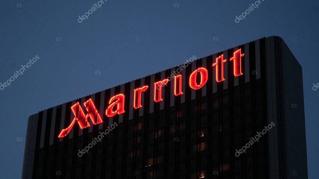 Frankfurt am Main, Hessen, Germany, 6th of August, 2025: Marriott hotel, Logo on facade at night. Marriott International. American multinational company that operates, franchises, and licenses lodging brands that include hotel, residential, and