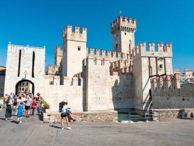 Rocca Scaligera,Sirmione,Garda Lake, Italy. June 28, 2022. Historical castle and old town on small island, view of beautiful harbor clipart