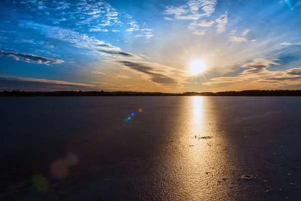 stock image A beautiful covered with ice lake in the Winter.Beautiful evening at sunset.