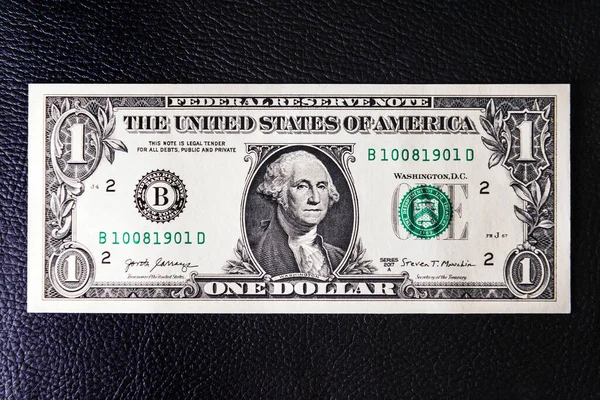 Ένα Δολάριο Μαύρο Δερμάτινο Φόντο Επιχειρηματική Έννοια Κάτοψη — Φωτογραφία Αρχείου