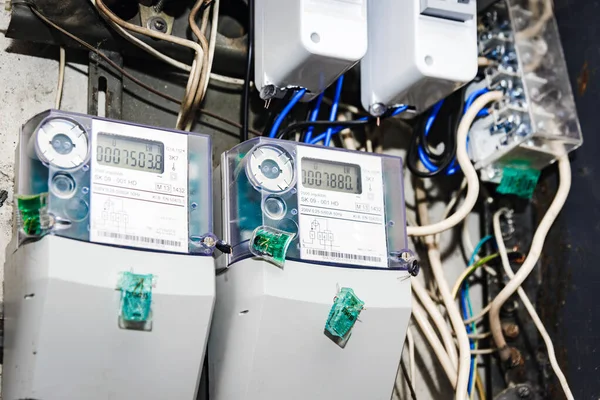 stock image Kilowatt hour electric meters, power supply meters.Close-up of modern smart grid residential digital power supply meter.Indoors shot.Selective focus.