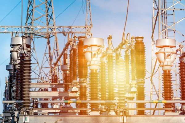 stock image High voltage circuit breaker in a power substation.Electric power transmission lines in the evening. High voltage switchgear and equipment of power plant.