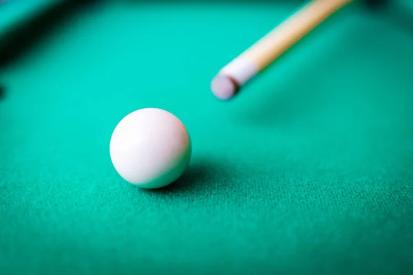 stock image Billiard pool game one white ball with cue on billiard table with green cloth.Selective focus.