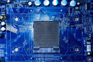 Devre bilgisayarı ana kartı, devre çipi tahtası. Donanım ana kart yarı iletkeni, donanım ana tahtası. Mavi renkli devre kartı arka planı..