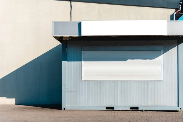 stock image A bankrupt store with closed window.shops closing down due to bad economic climate.Empty store front economic crisis.Closed shop.Sunny summer day.