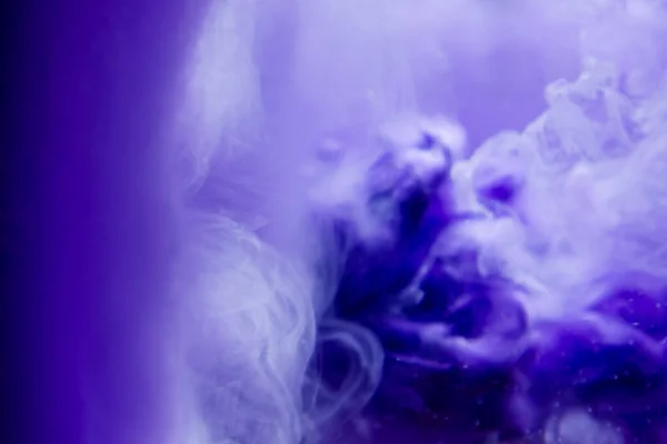 Ink water abstract burst.Color mist.Fantasy cloud.Blue paint flow.Purple creative abstract background.Blurred background.
