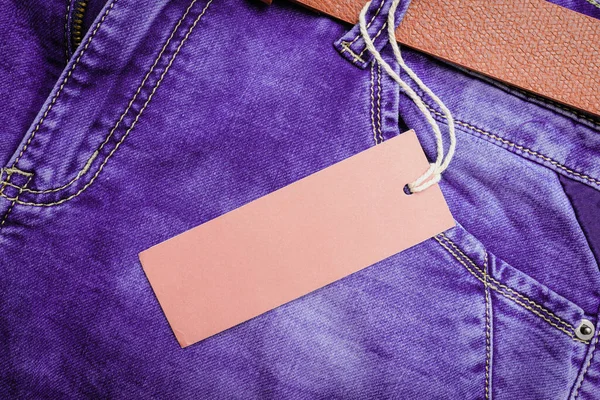 Purple Denim Jeans,belt,jeans pants with leather belt.label,sticker,tab,tag on the jeans.Empty blank space.Mockup,template.closeup.Copy space.