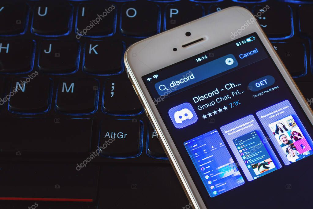 Discord app icon on phone screen with logo on blurry screen background.Selective background.Telsiai,Lithuania.07-25-2023.
