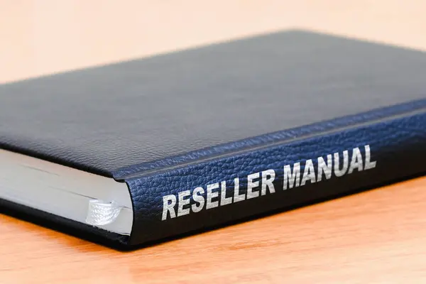 Reseller manual business black book on the office wooden table.Closeup,selective focus.