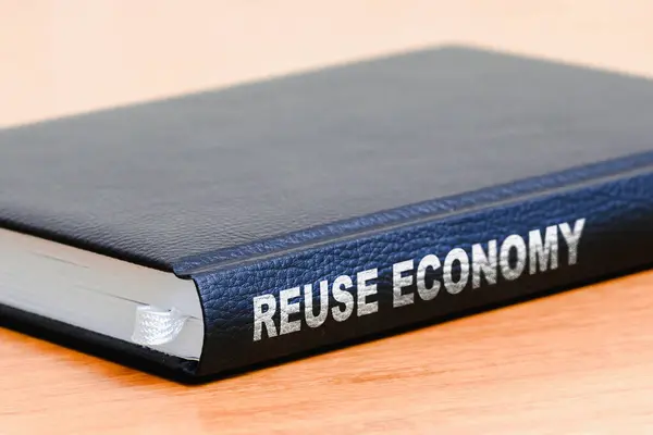Reuse economy business black book on the office wooden table.Closeup,selective focus.