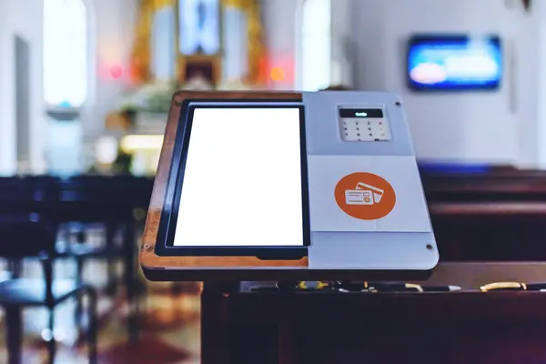 Mockup white screen.Electronic card payment terminal for church donations.A credit card reader in a church for the collect.Copy space.