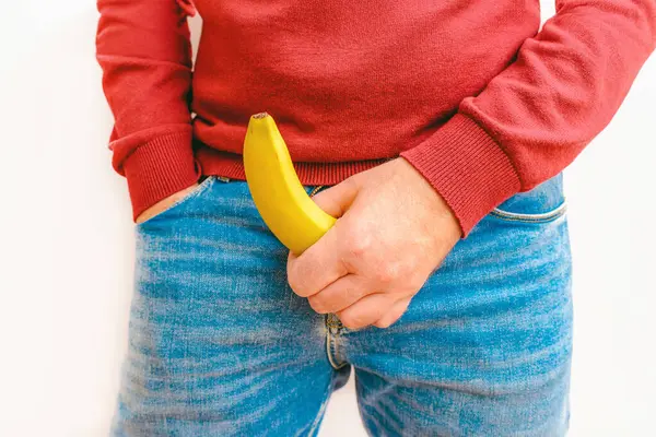 Homem Segura Uma Banana Fundo Branco Close Conceito Potência Impotência Imagem De Stock