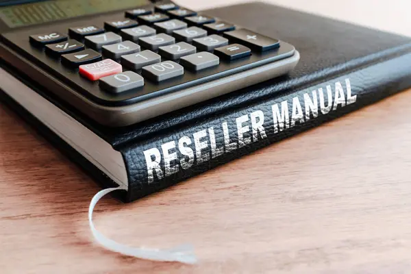 Reseller manual business black book,calculator on the office wooden table.Closeup,selective focus.
