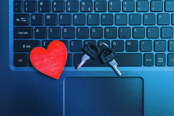 Online Dating Concept.Online date. Heart,keys on the laptop computer keyboard.Closeup.
