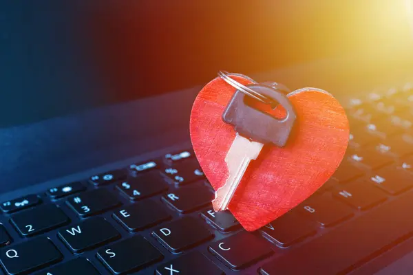 Online Dating Concept.Online date. Heart,keys on the laptop computer keyboard.Closeup.