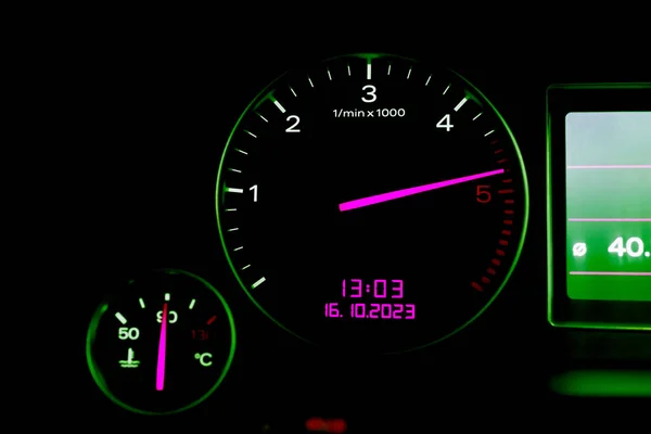 Car\'s dashboard.Modern car dashboard panel at night time.Closeup,selective focus.Toned.